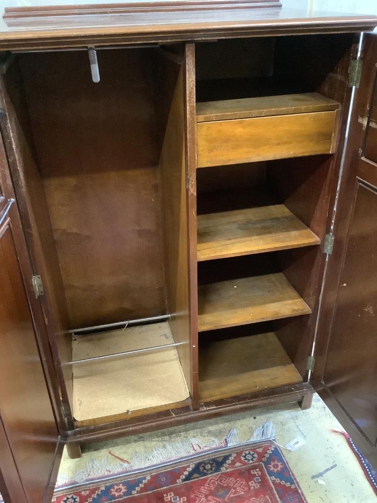 An Edwardian mahogany two door compactum